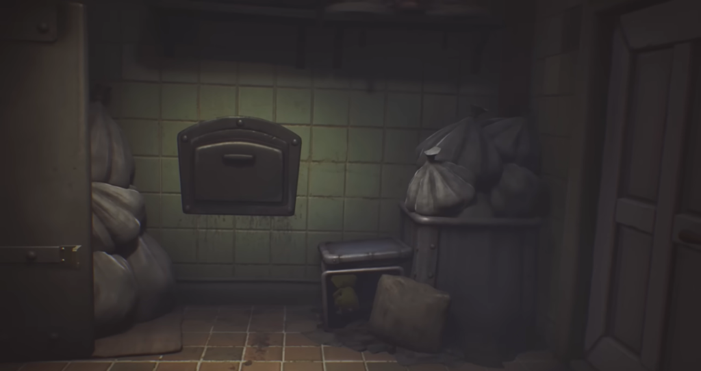 Trash bags piled in tiled room beside bin