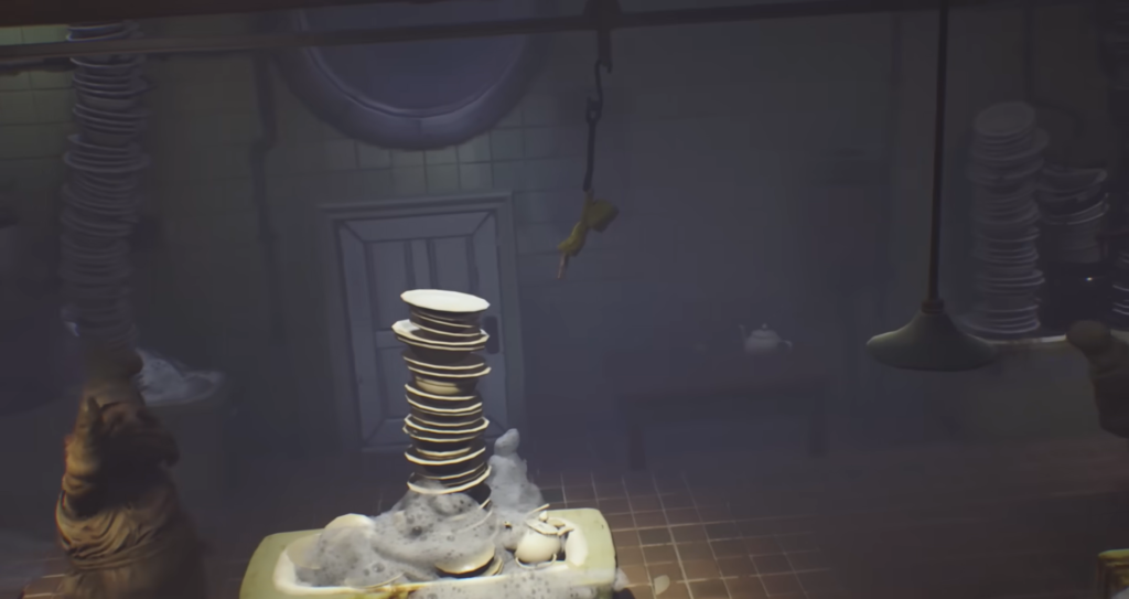 Stacked plates in soapy sink in kitchen