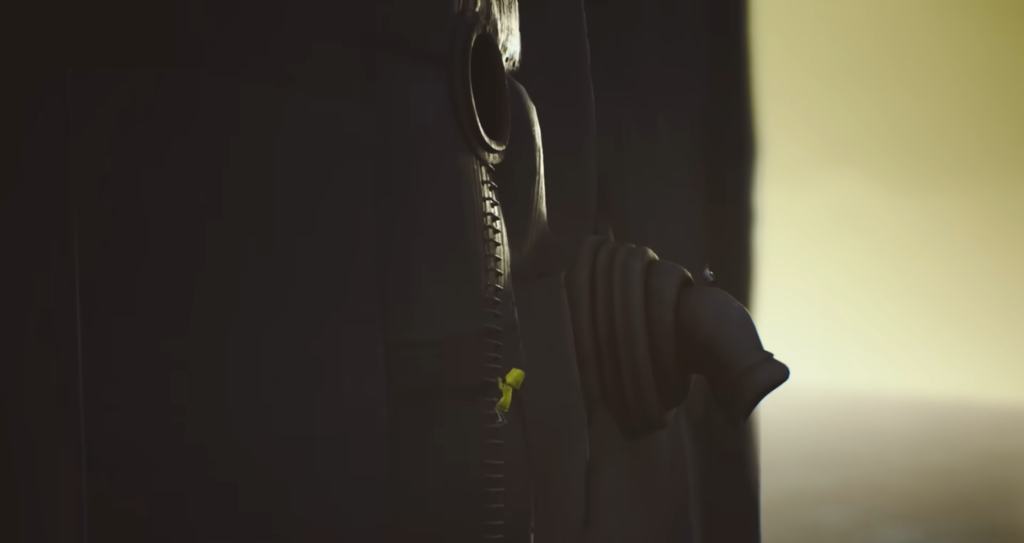 Black backpack zipper and strap close-up outdoors