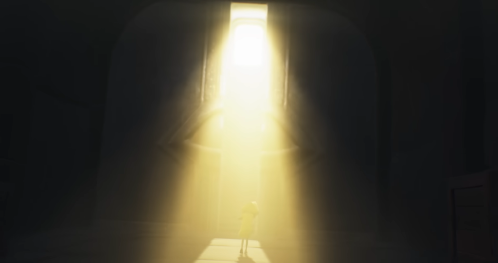 Small figure standing under bright doorway light indoors