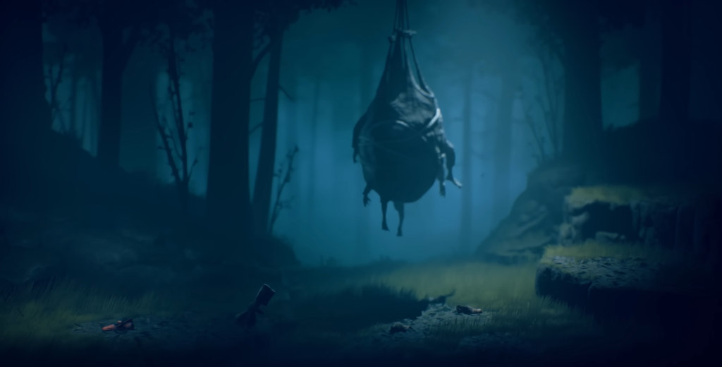 Hanging cocoon sways in blue foggy forest