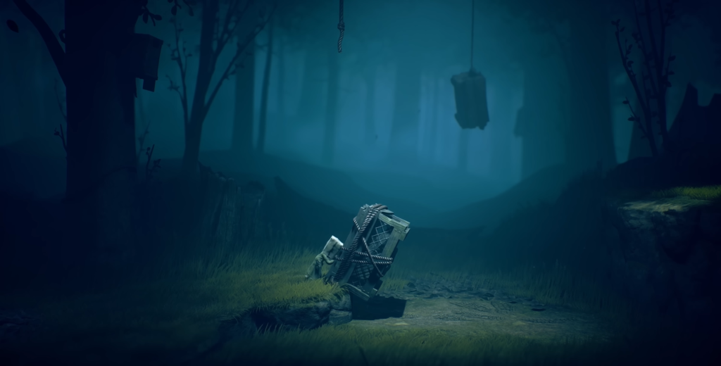 Broken wooden cart lying on path in foggy forest