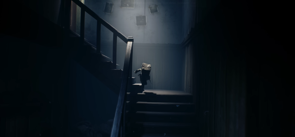 Small figure climbs stairs in dark hallway