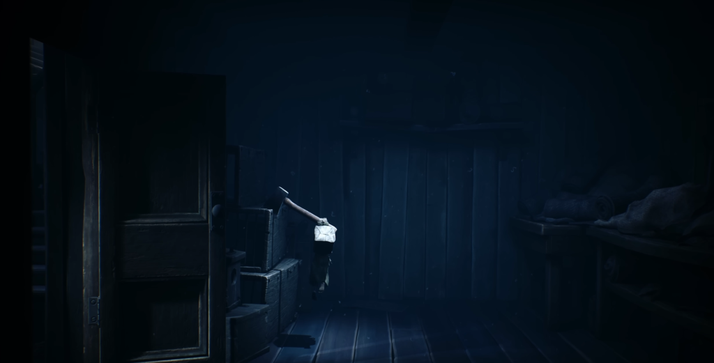 Small figure climbing stacked boxes in dark room