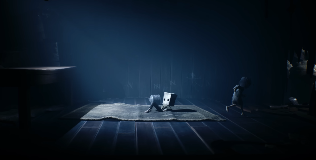 Six and Mono crawl on rug in Little Nightmares