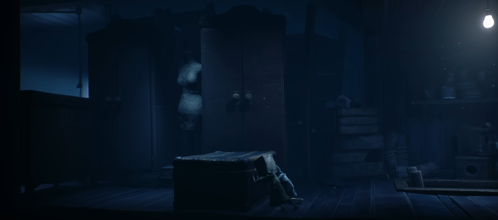Six from Little Nightmares hides under chest in room