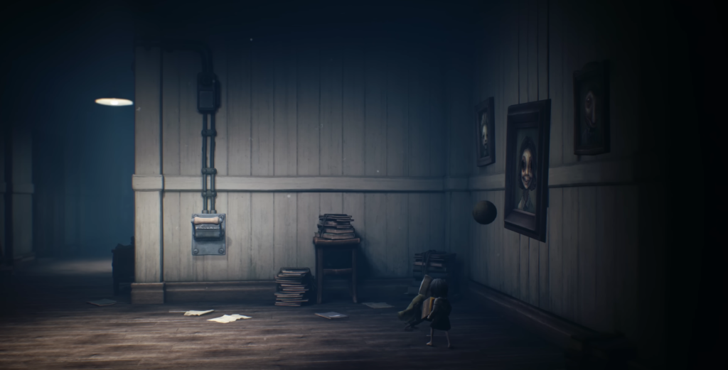 Small figure walks past portraits in dark hallway