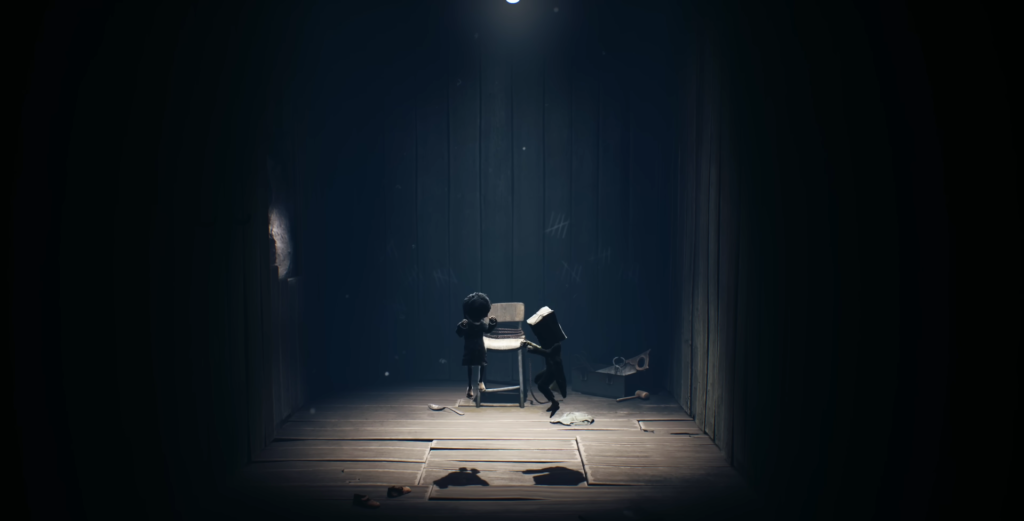 Six and Mono from Little Nightmares II opening suitcase indoors