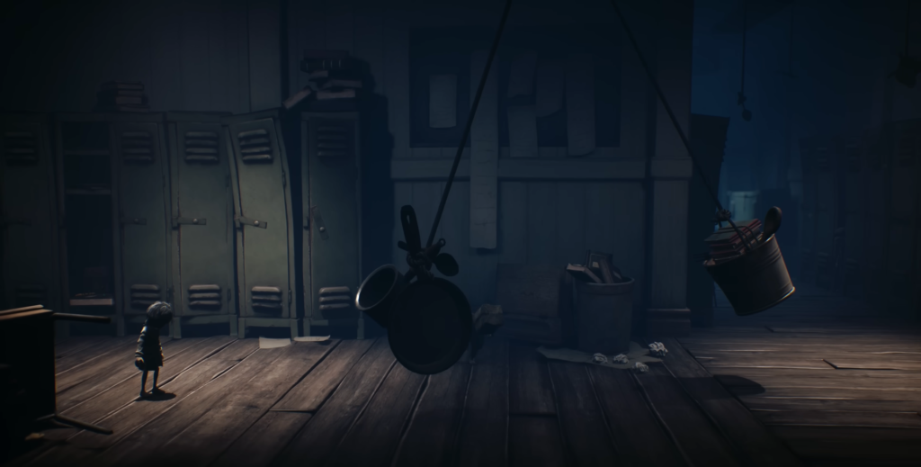 Little Nightmares character stands near lockers in room