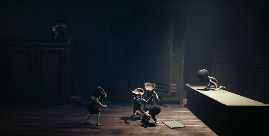 Children fighting in dark room with spotlight