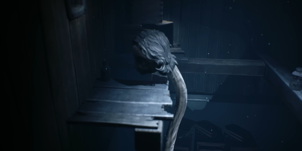 Long-haired figure climbing wooden ledge in dark room