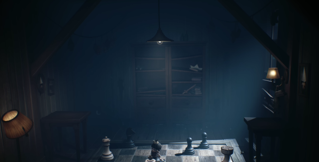 Chess pieces on wooden board in dim attic
