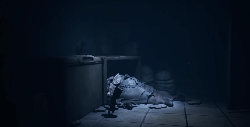 Small figure walking past body in dark room