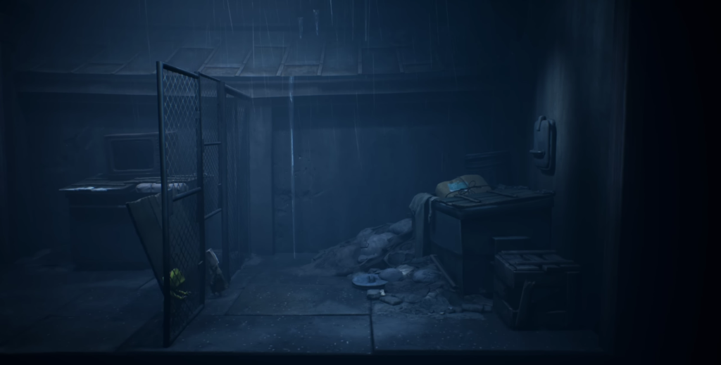 Rain falls inside dark room with metal gate