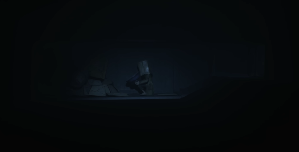 Small figure crouches in dark room doorway