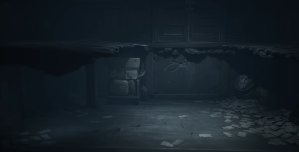 Abandoned room with broken ceiling and scattered papers