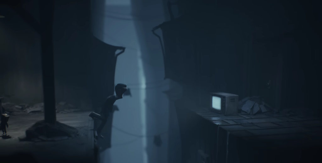 Little Nightmares character climbs wall beside glowing TV indoors