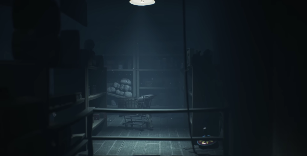 Shopping cart sits in dark storage room