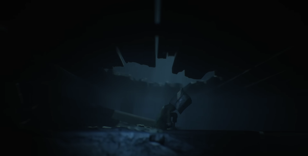 Small figure holding flashlight in dark cave