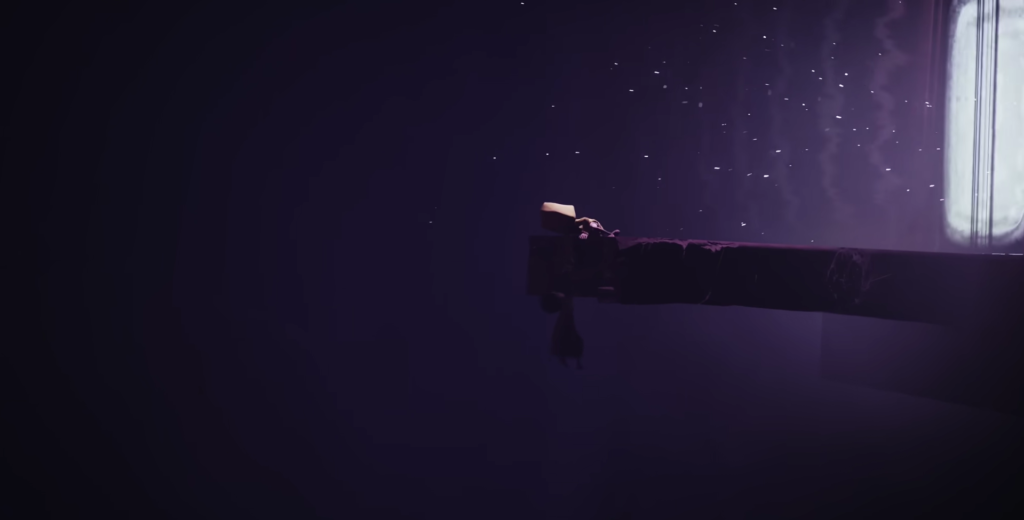 Person lying on bed under starry window