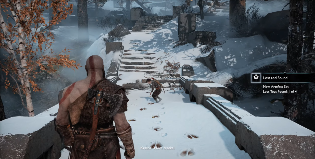 Kratos follows Atreus on snowy path in God of War