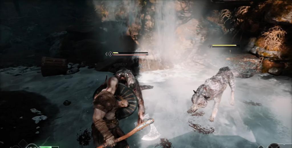 Kratos fights wolves on icy ground near waterfall