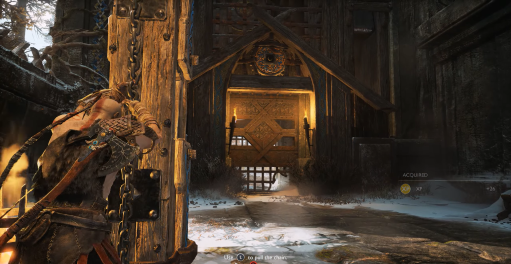 Kratos pulls chain beside wooden gate in snow