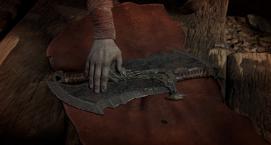 Hand touching ornate axe on brown leather surface