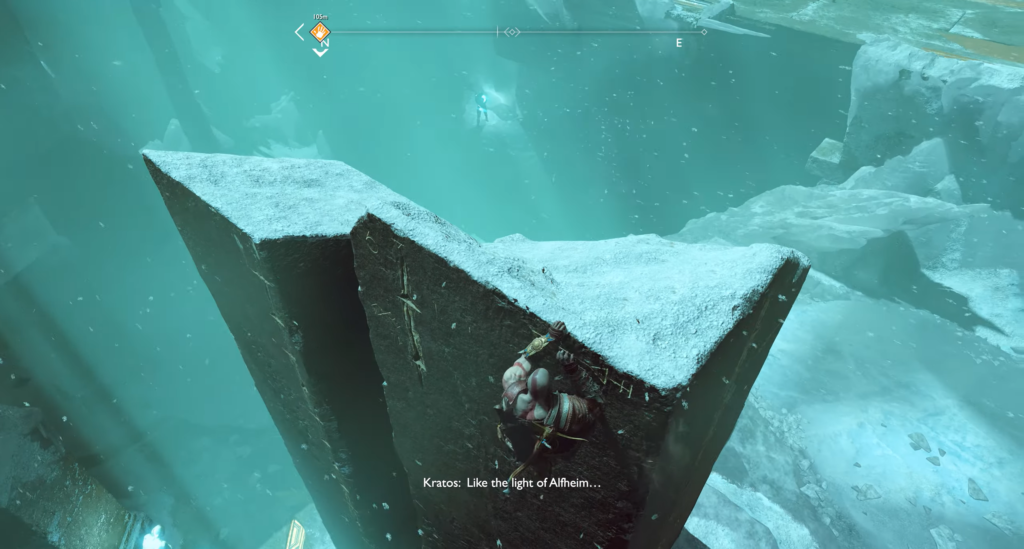 Kratos climbs icy rock in God of War