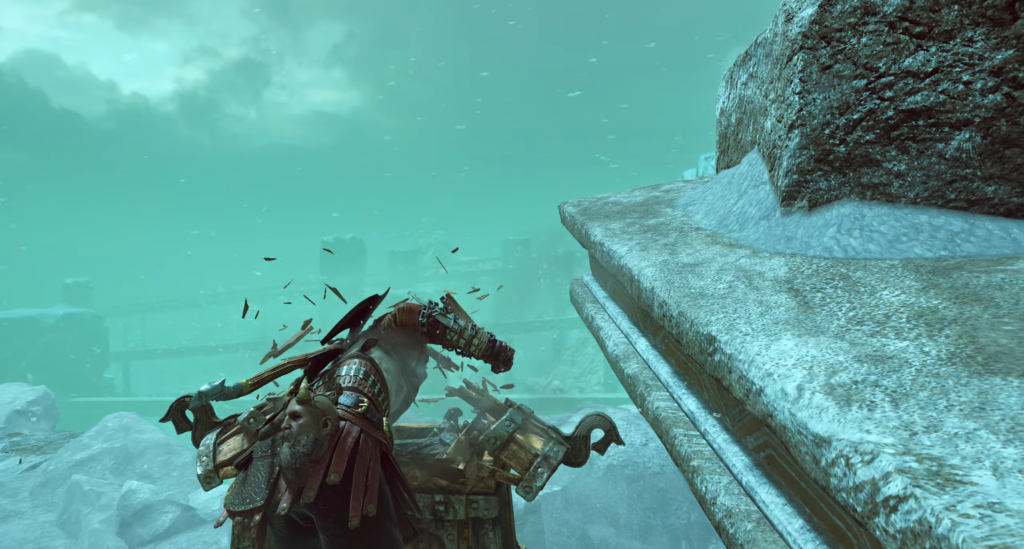 Kratos from God of War smashes chest in snow