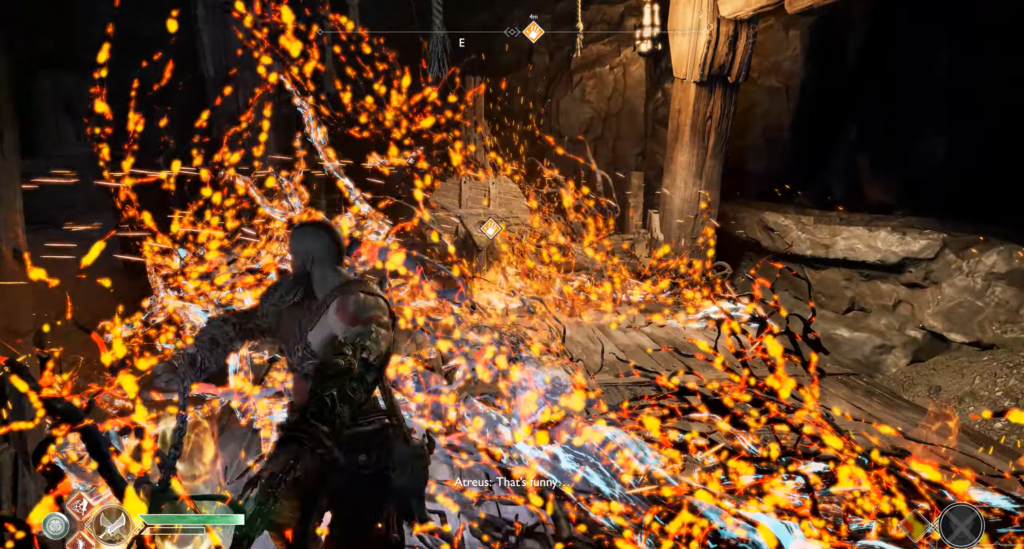 Kratos fights amid orange sparks in cave, God of War