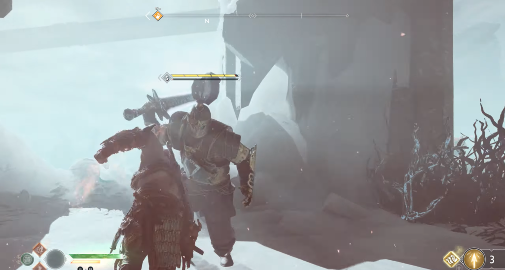 Kratos fights armored enemy in snowy cave, God of War