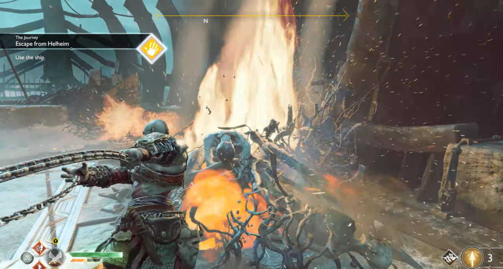 Kratos attacks enemies amid flames in God of War