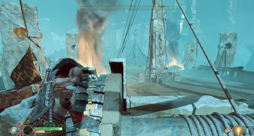 Kratos aims ballista at burning ruins in God of War