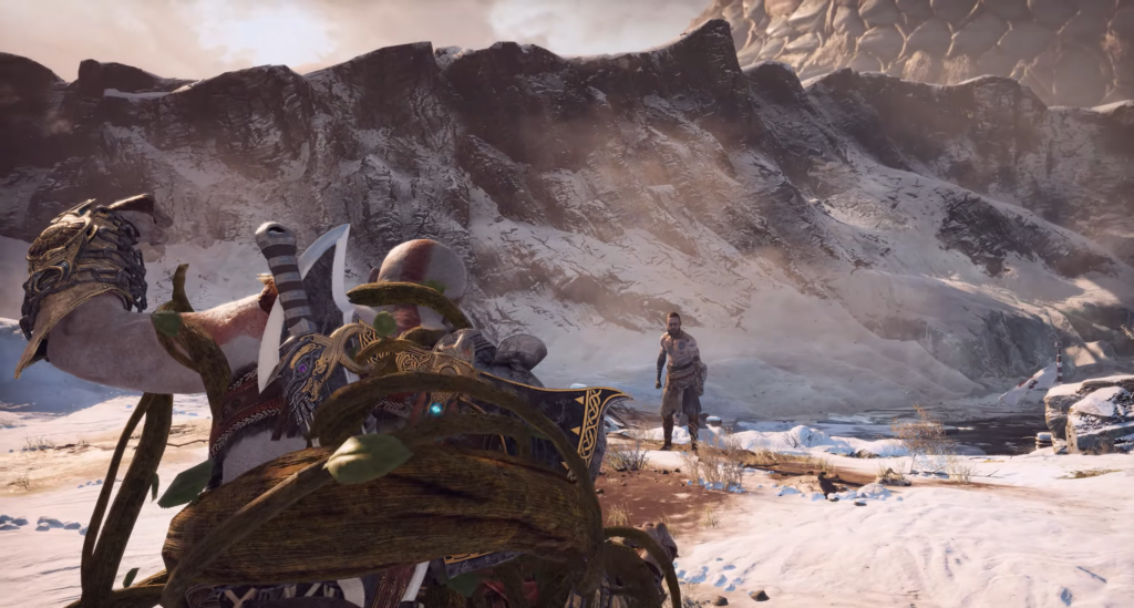 Kratos aims axe at Baldur in snowy mountains, God of War