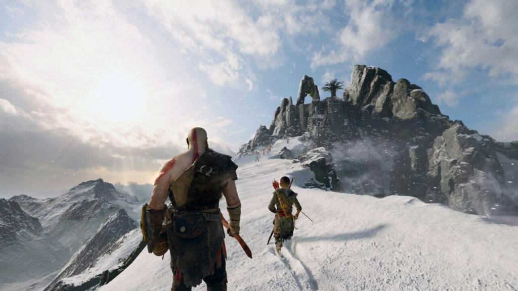 Kratos and Atreus walk on snowy mountain ridge