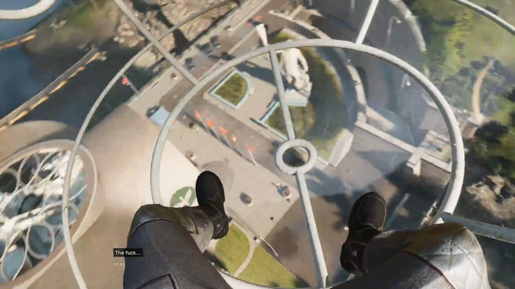 Person dangling legs above city street