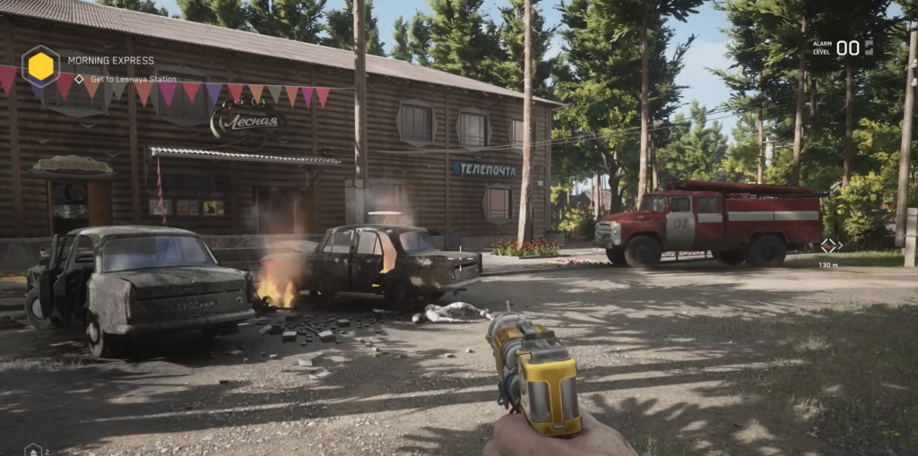Player aims yellow pistol at burning cars outside station