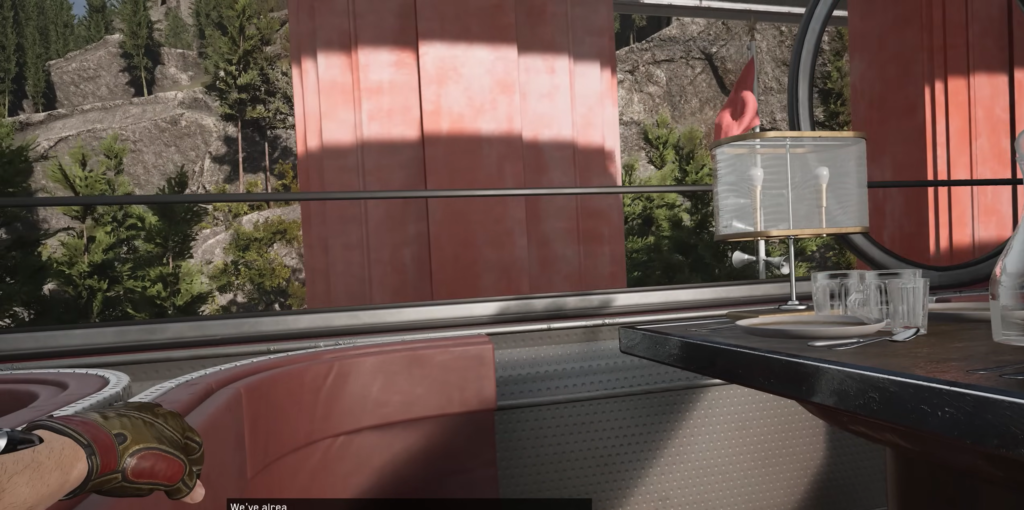 Gloved hand resting in diner booth by table