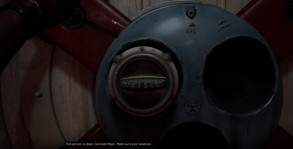 Metal hatch with porthole on wooden wall