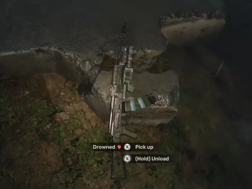 Picking up rifle from rocky crevice