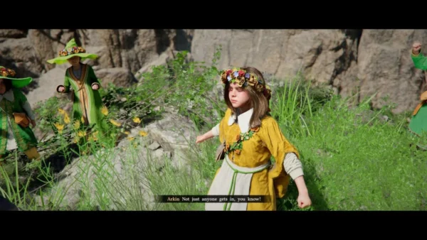 Girl wearing flower crown stands in grassy rocks